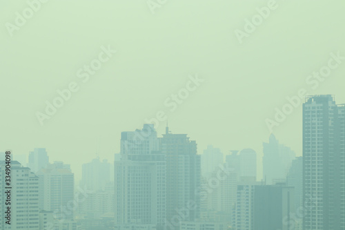 smog city in summer, haze of pollution covers city, global warming concept