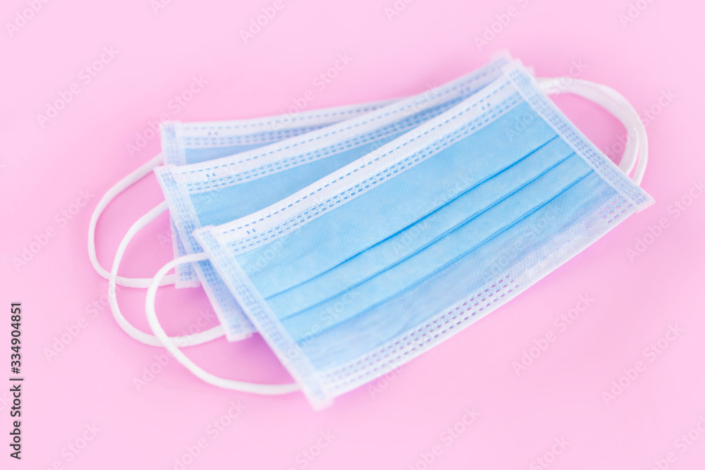 Medical mask isolated on blue background for protect air polution or virus covid 19, health care concept Medical mask isolated on blue background for protect air polution or virus covid 19, health care concept