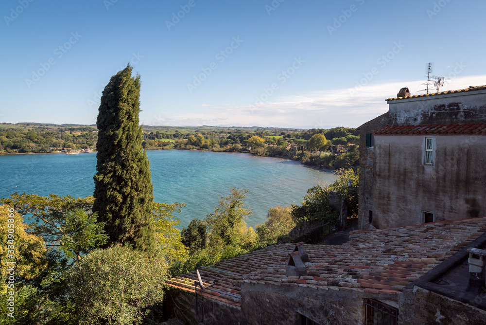 Overlooking historic buildings and a beautiful lake in the town of Anguillara in Italy
