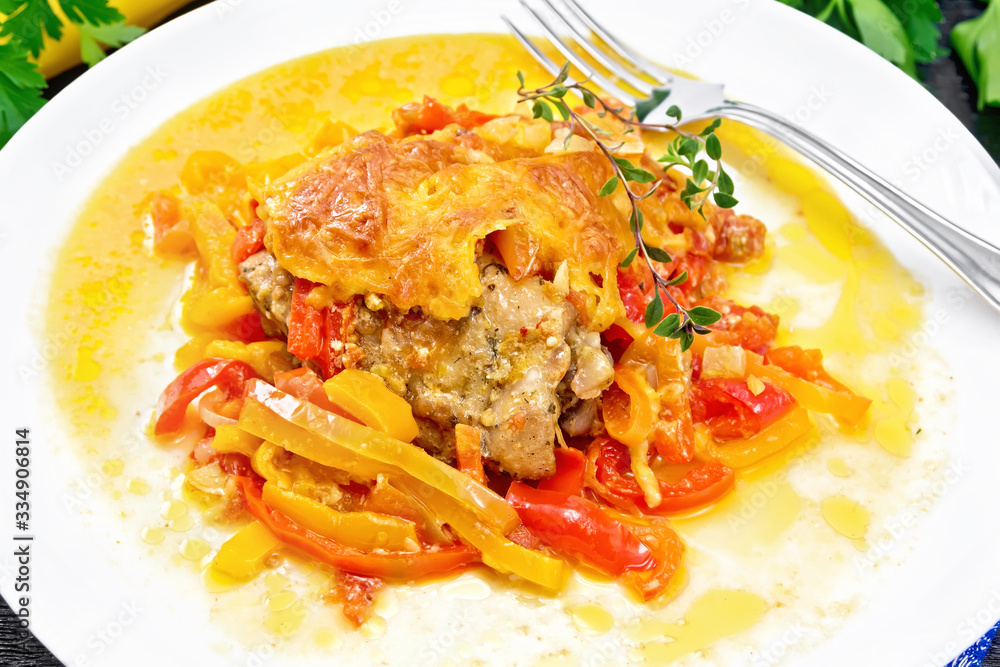 Chicken with pepper in white plate on napkin Chicken with pepper in white plate on napkin
