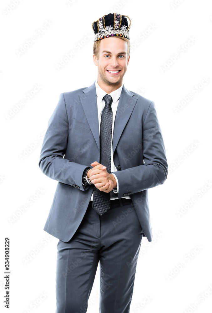 Happy smiling handsome confident businessman in grey suit and crown, isolated over white background. Leadership and business success concept. Happy smiling handsome confident businessman in grey suit and crown, isolated over white background. Leadership and business success concept.