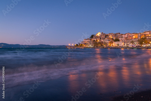 Fototapeta Naklejka Na Ścianę i Meble -  Colourful reflections of lights on the water from the town of Anguillara Sabazia in Italy