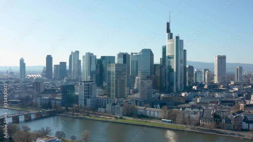 Skyline and skyscrapers of frankfurt am main with the river main cinematic panorama rotating aerial drone shot 4K 25p
