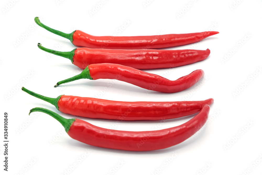 Five fresh juicy peppers isolated on a white background