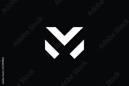 Minimal elegant monogram art logo. Outstanding professional trendy awesome artistic M MX XM initial based Alphabet icon logo. Premium Business logo White color on black background photo