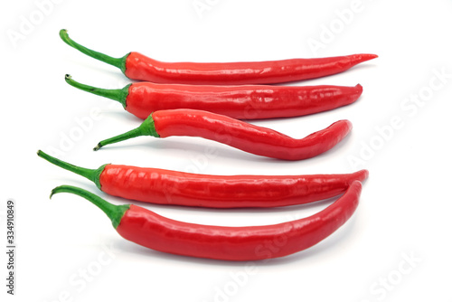 Five fresh juicy peppers isolated on a white background