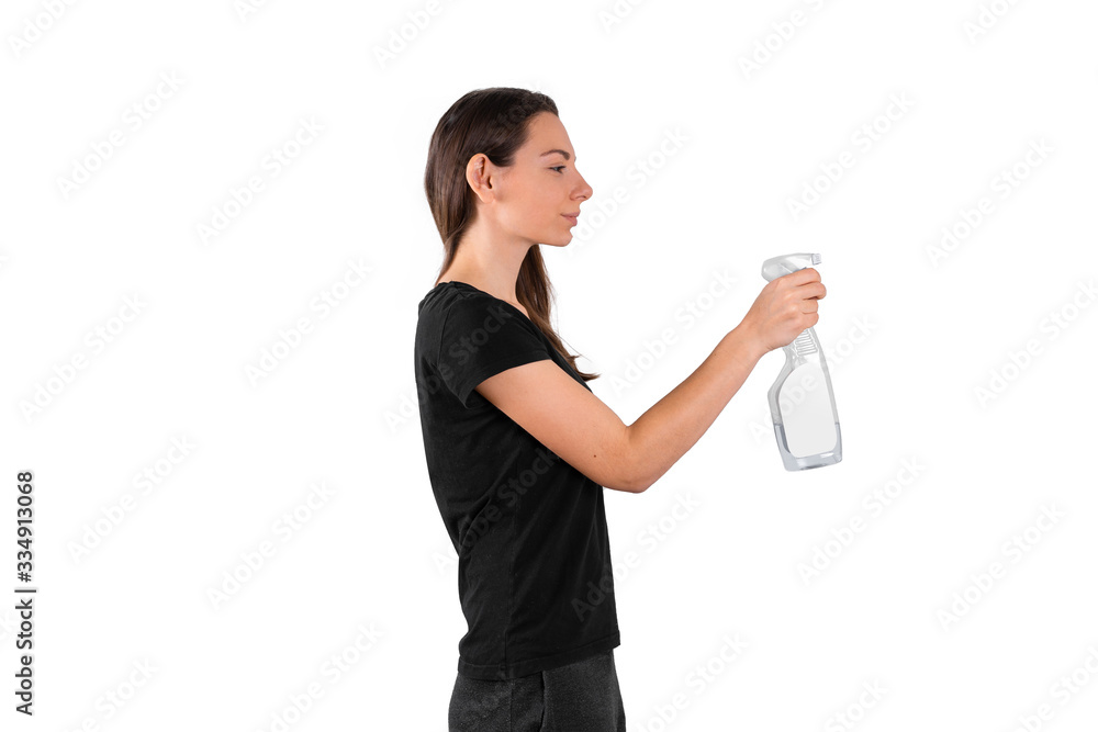 Young woman holding spray plastic bottle with cleaning liquid. Spring cleaning concept. Disinfecting Young woman holding spray plastic bottle with cleaning liquid. Spring cleaning concept. Disinfecting