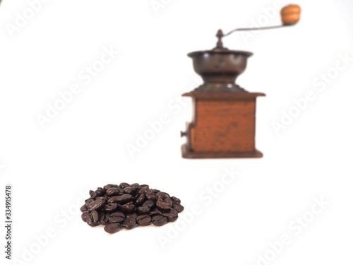 Manual coffee grinder and coffee bean isolate on white background.Have copy space.for banner,wallpaper.