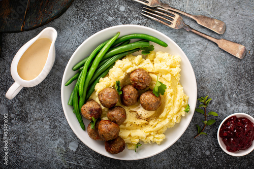 Swedish meatballs with mashed potatoes, gravy and lingonberry jam photo