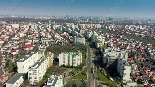 Aerial view of Bucharest Romania during the spring time march sunny view of aerial cityscape buildings cars trees with no traffic strange almost deserted photo