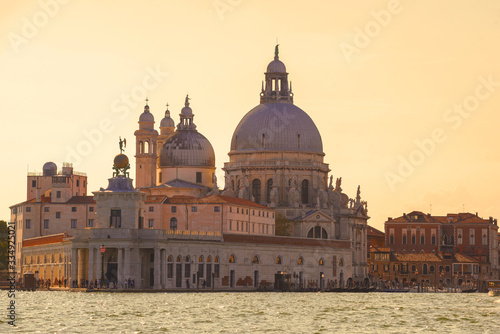 Basilica di Santa Maria della Salute and the ancient customs building of Punta della Dogana on a sunny September evening. Venice, Italy