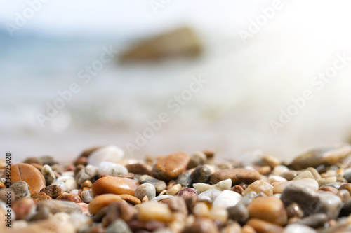 Close up rock sand with blur tropical beach and blue sky abstract background.