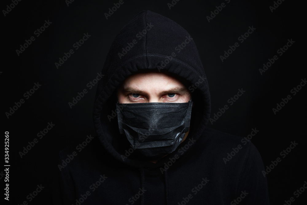 Man in Mask and Hood. Boy in Black Mask and Hoodie Man in Mask and Hood. Boy in Black Mask and Hoodie