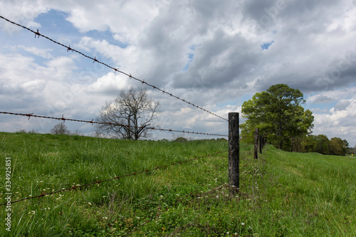 Low angle view of barbed wire fence