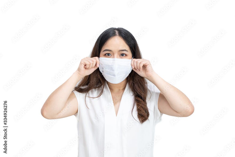 Close up of Asian girl wearing protective mask, with copy space, isolated on white background. Concept of Coronavirus COVID-19, Coronavirus disease pandemic. Close up of Asian girl wearing protective mask, with copy space, isolated on white background. Concept of Coronavirus COVID-19, Coronavirus disease pandemic.