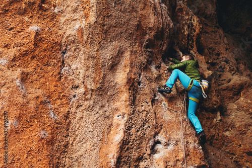 Man climbs a rock. 