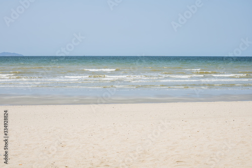 Beautiful beach with white sand and blue and clear sky background for travel and nature concept