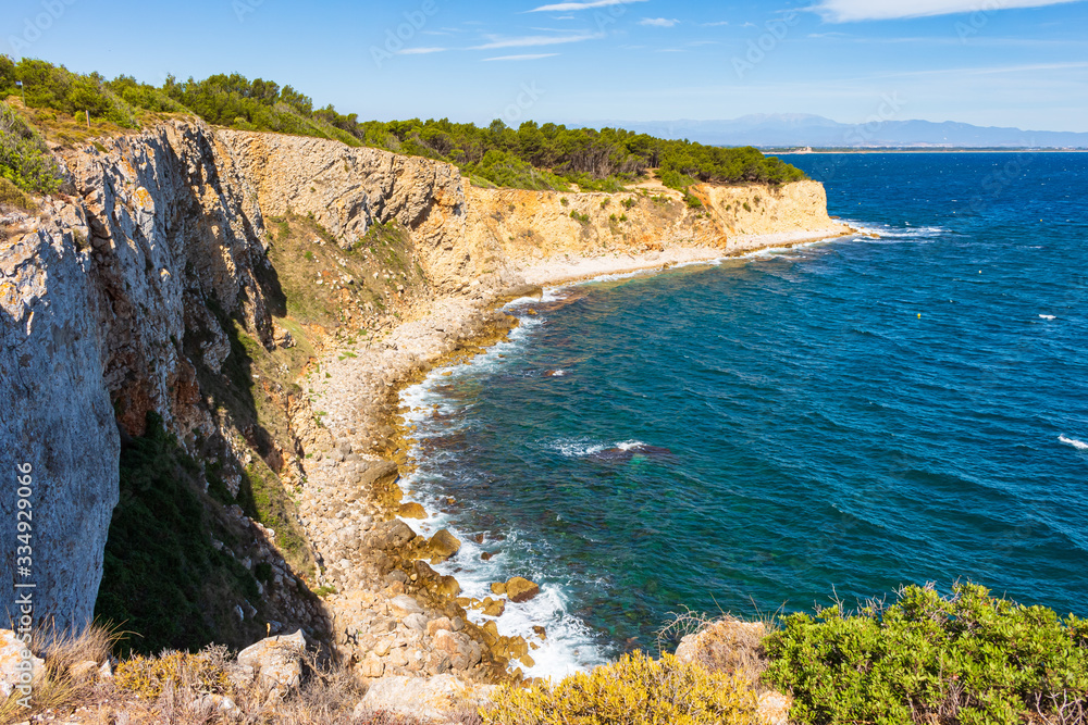 View of the cliffs of the Montgri Natural Park with the Bahía de Rosas in the background. Costa Brava, Catalonia, Spain