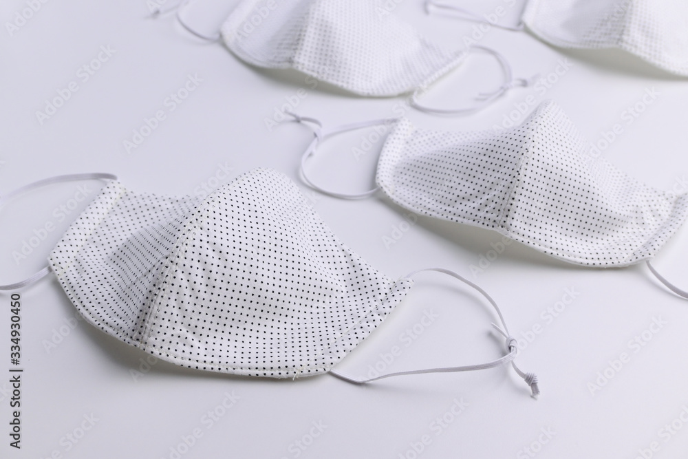 design of face mask handmade sewing from fashion fabric cotton cloth on white background design of face mask handmade sewing from fashion fabric cotton cloth on white background