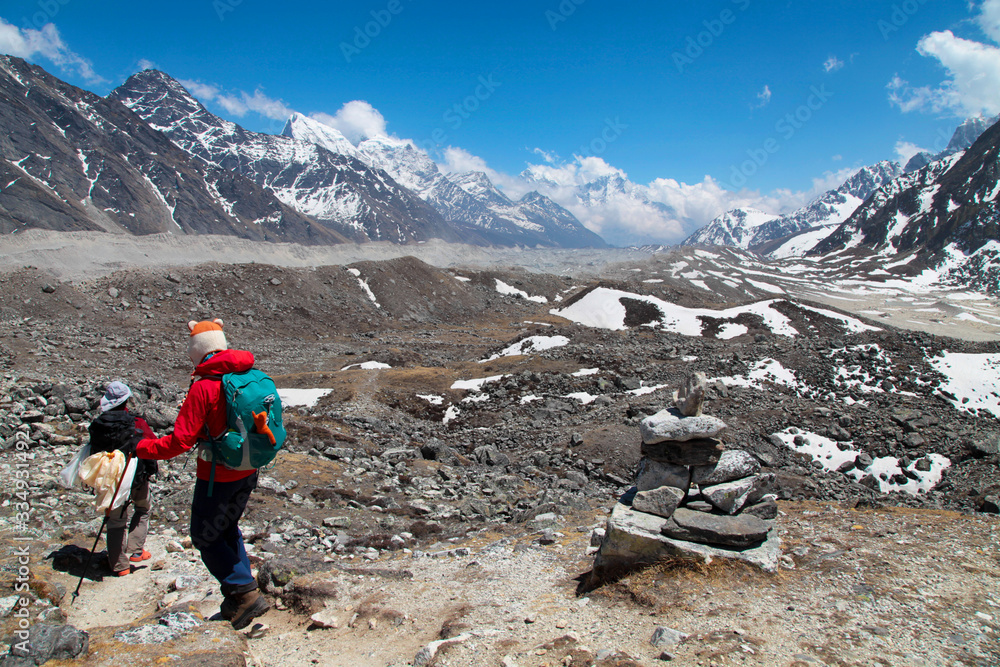 Group of climbers in snow mountains. Team work concept. Sagarmatha national park, trek to Everest base camp - Nepal Himalayas. Group of climbers in snow mountains. Team work concept. Sagarmatha national park, trek to Everest base camp - Nepal Himalayas.