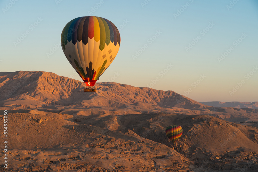 Hot air Balloons over Valley of the King in Luxor city in a morning, Upper Egypt