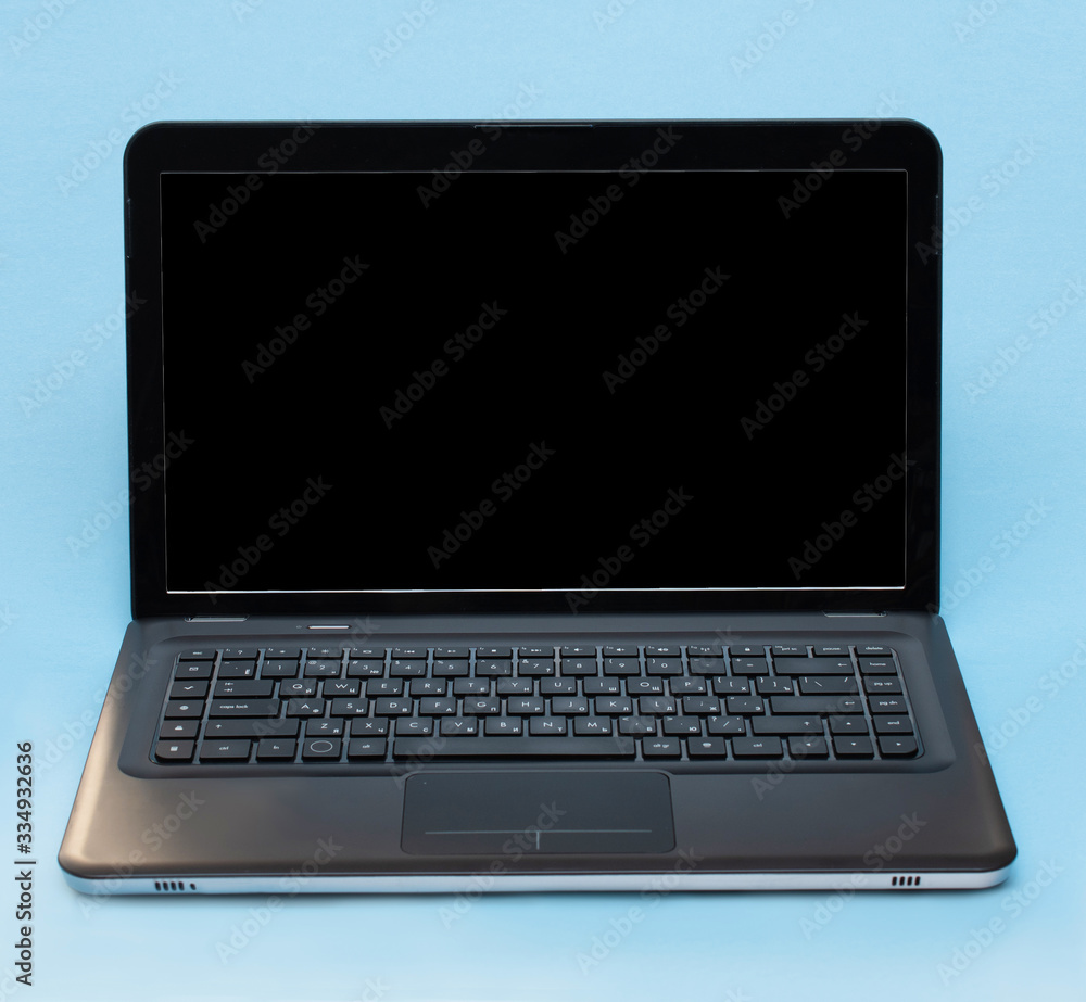 Laptop on a blue background, text frame, remote education, work at home, freelance, online shopping Laptop on a blue background, text frame, remote education, work at home, freelance, online shopping