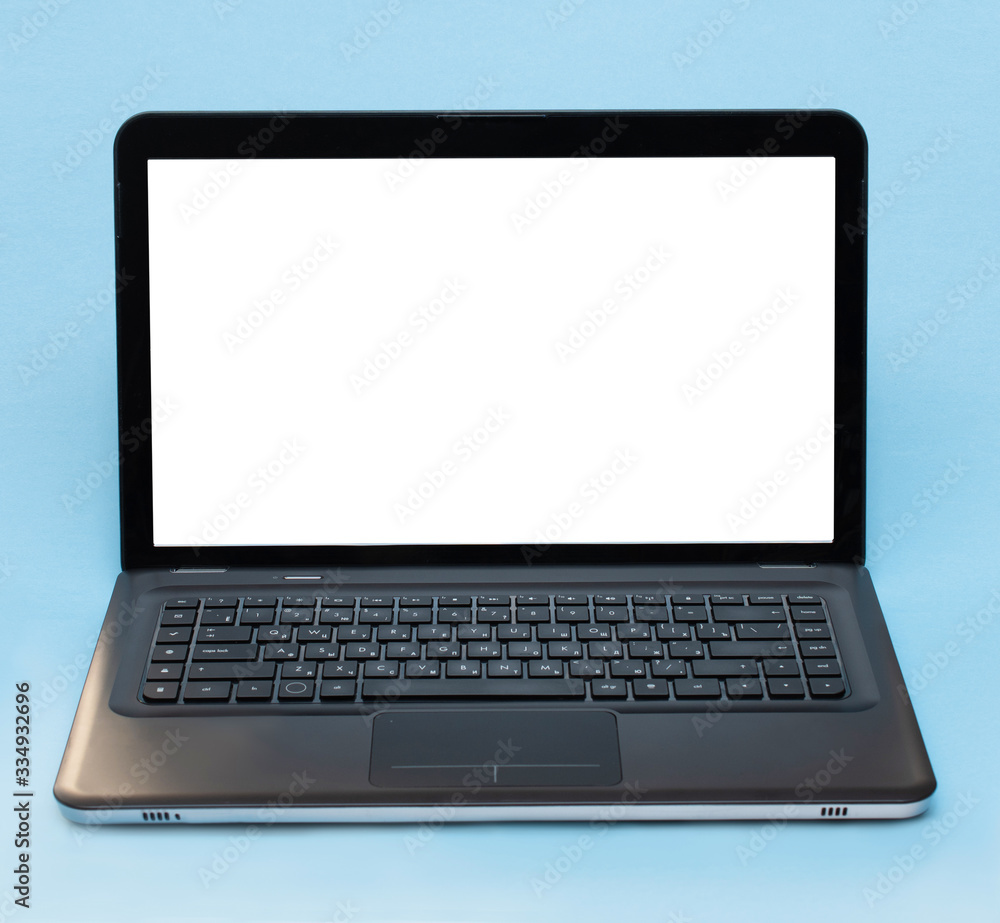 Laptop on a blue background, text frame, remote education, work at home, freelance, online shopping Laptop on a blue background, text frame, remote education, work at home, freelance, online shopping