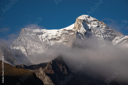 Kongde mountain peak above the cloud view from Namche Bazaar village, Everest region, Himalaya mountain range in Nepal