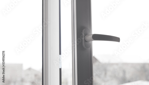 White opened window with handle.