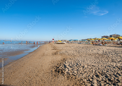  People are resting on a sunny day at the beach in Cesenatico  Italy