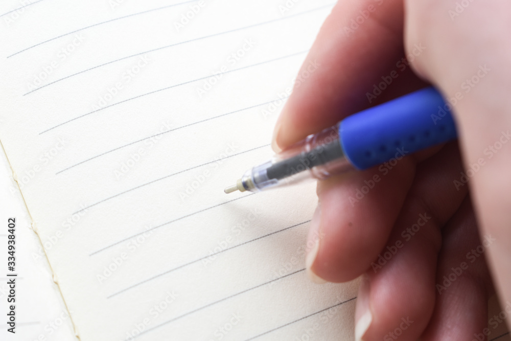 hand writes on a sheet