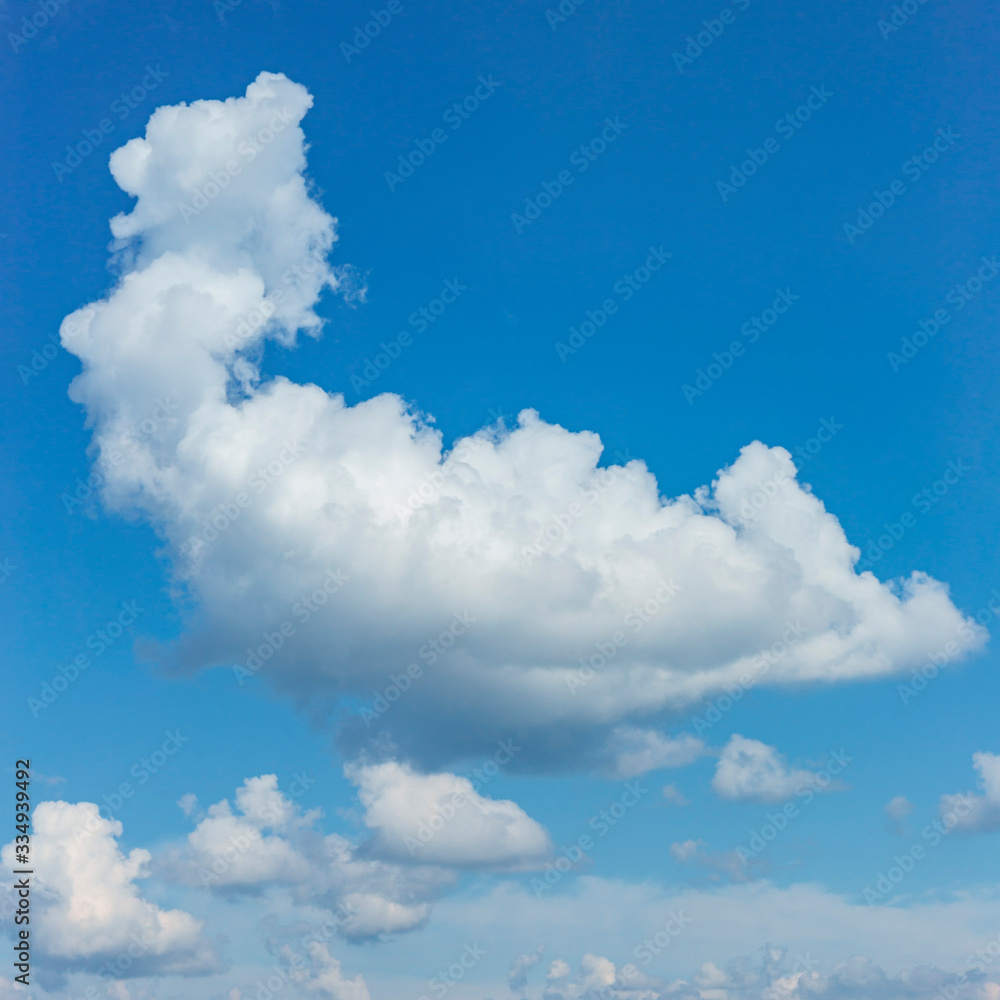 big white cumulus cloud in the blue sky as a natural background big white cumulus cloud in the blue sky as a natural background
