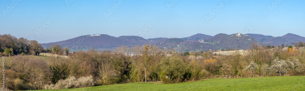 GERMANY, BONN. View across the Rhine valley towards the mountain range Siebengebirge with hotel Petersberg an the castles Drachenburg and Drachenfels GERMANY, BONN. View across the Rhine valley towards the mountain range Siebengebirge with hotel Petersberg an the castles Drachenburg and Drachenfels
