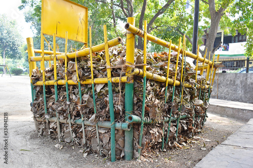 Large size big bamboo bin in garden for putting dry leaves for producing compost from leaves