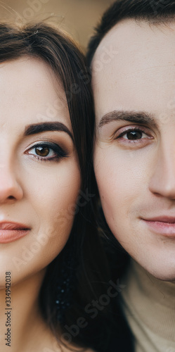 Two halves of the faces of a man and a woman close-up. Photography, concept, idea.