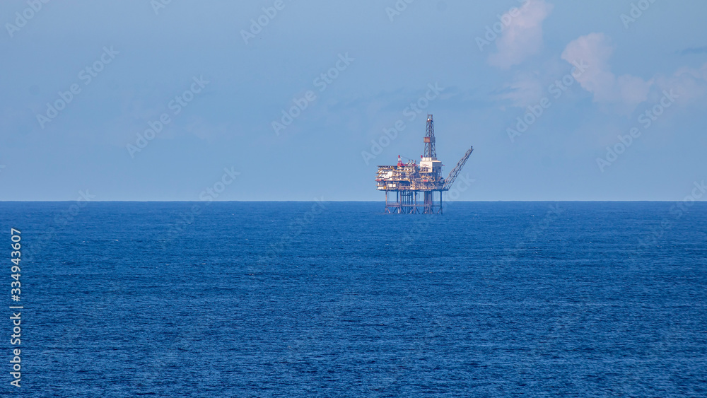 Oil platform inside the sea on a sunny day.
