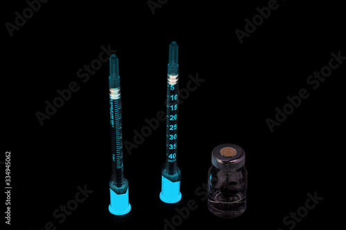 anti venom, anti virus, Medicine,vaccine, antidote, antivirus with injection syringe straight isolated on black background