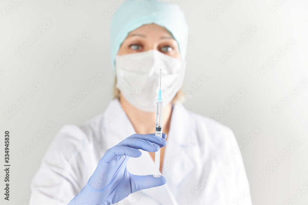 Female doctor prepared to give an injection to a sick patient Female doctor prepared to give an injection to a sick patient