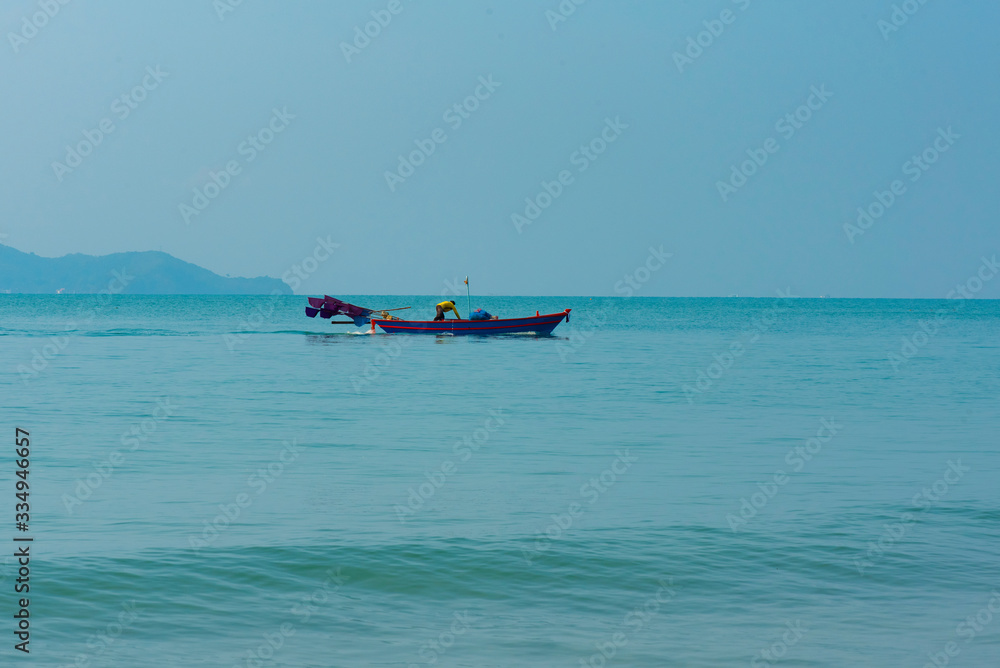 Blue sea water with Folk fishing boat for background, nature background concept. Blue sea water with Folk fishing boat for background, nature background concept.