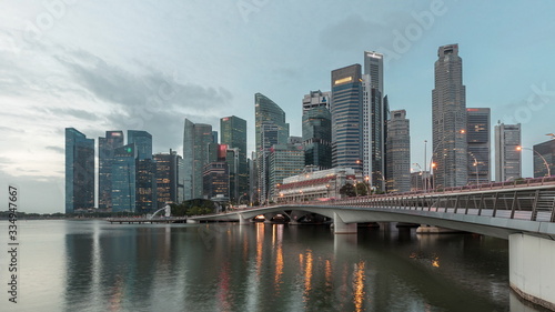 Esplanade bridge and downtown core skyscrapers in the background Singapore night to day timelapse