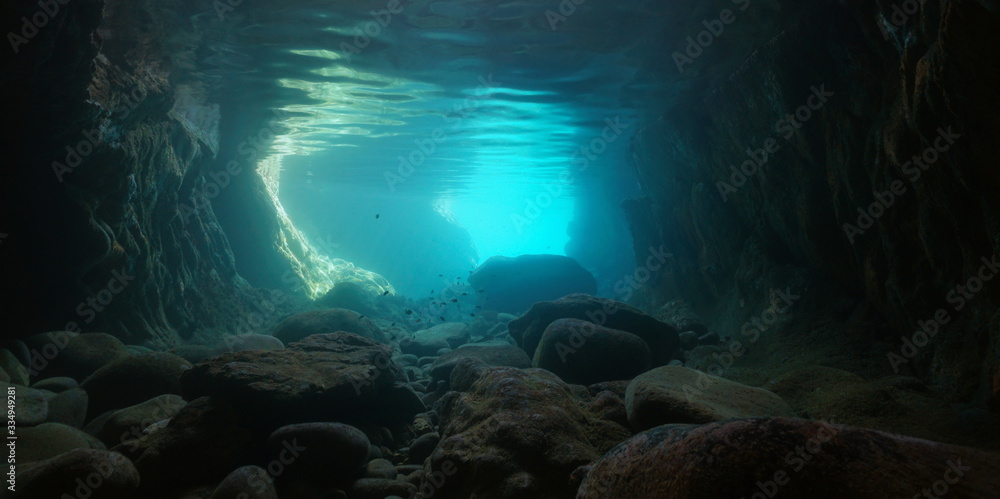 Rocks underwater inside a sea cave on the shore, natural scene, Mediterranean sea, Spain, Costa Brava, Catalonia