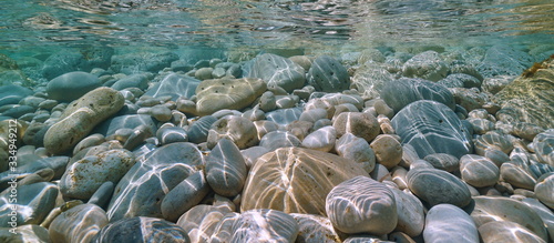 Obraz na płótnie Pebbles and rocks underwater near sea shore, natural scene, Mediterranean sea, A