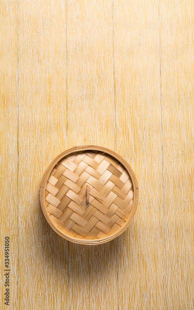 Empty basket of dim sum made by bamboo material. Chinese Traditional cuisine concept. Dumplings Dim Sum in bamboo steamer with text copy space. Asian food background Empty basket of dim sum made by bamboo material. Chinese Traditional cuisine concept. Dumplings Dim Sum in bamboo steamer with text copy space. Asian food background