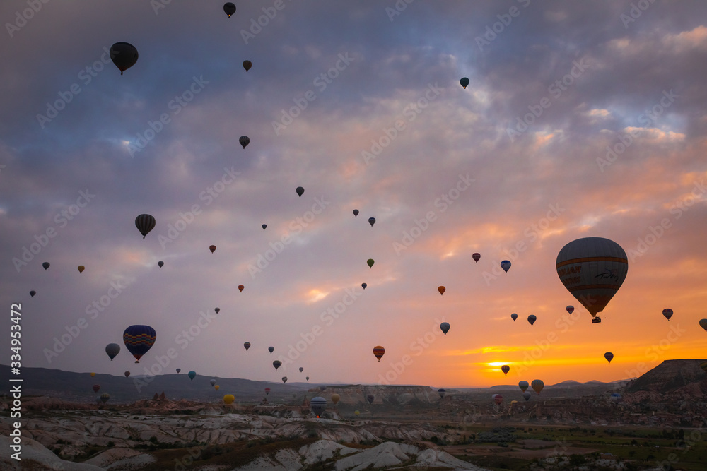 Baloons on the sky and typical Cappadocian landscape, close to Goreme. Nevsehir, Anatolia, Turkey Baloons on the sky and typical Cappadocian landscape, close to Goreme. Nevsehir, Anatolia, Turkey