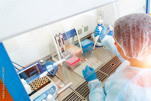 фотографія Laboratory assistants analyzing blood sample