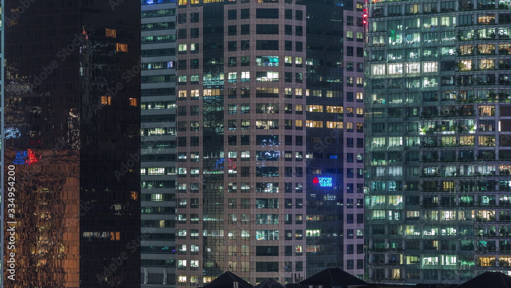 Aerial cityscape of Singapore downtown of modern architecture with skyscrapers night timelapse