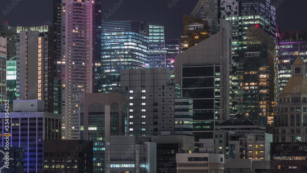 Aerial cityscape of Singapore downtown of modern architecture with skyscrapers night timelapse Aerial cityscape of Singapore downtown of modern architecture with skyscrapers night timelapse