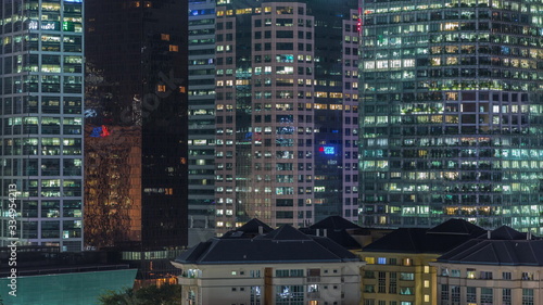 Aerial cityscape of Singapore downtown of modern architecture with skyscrapers night timelapse © neiezhmakov