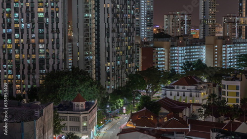 Aerial view of intersection and art deco shophouses along Neil road in Chinatown area night timelapse
