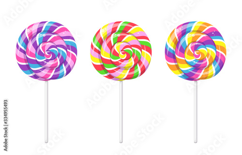 Photo Lollipop with spiral rainbow colors, twisted sucker candy on stick